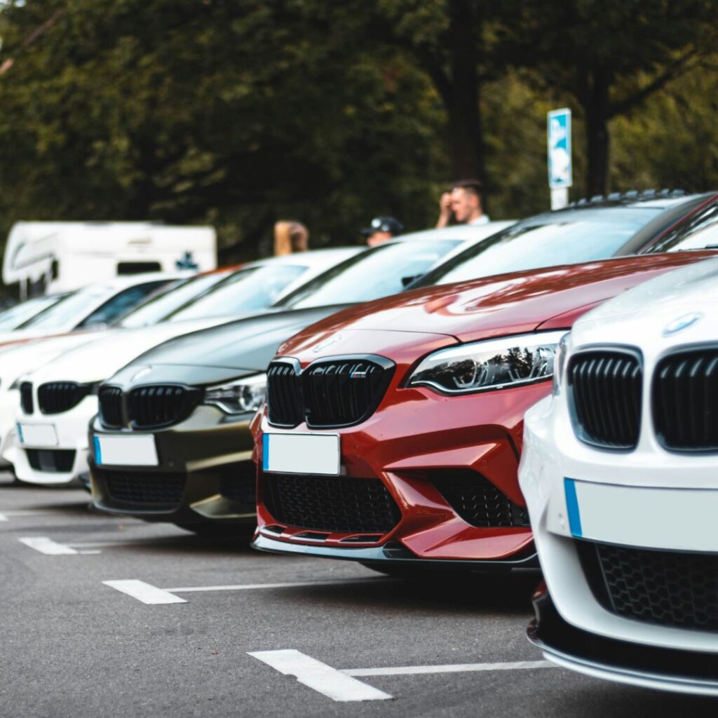 Group of cars in a parking lot.